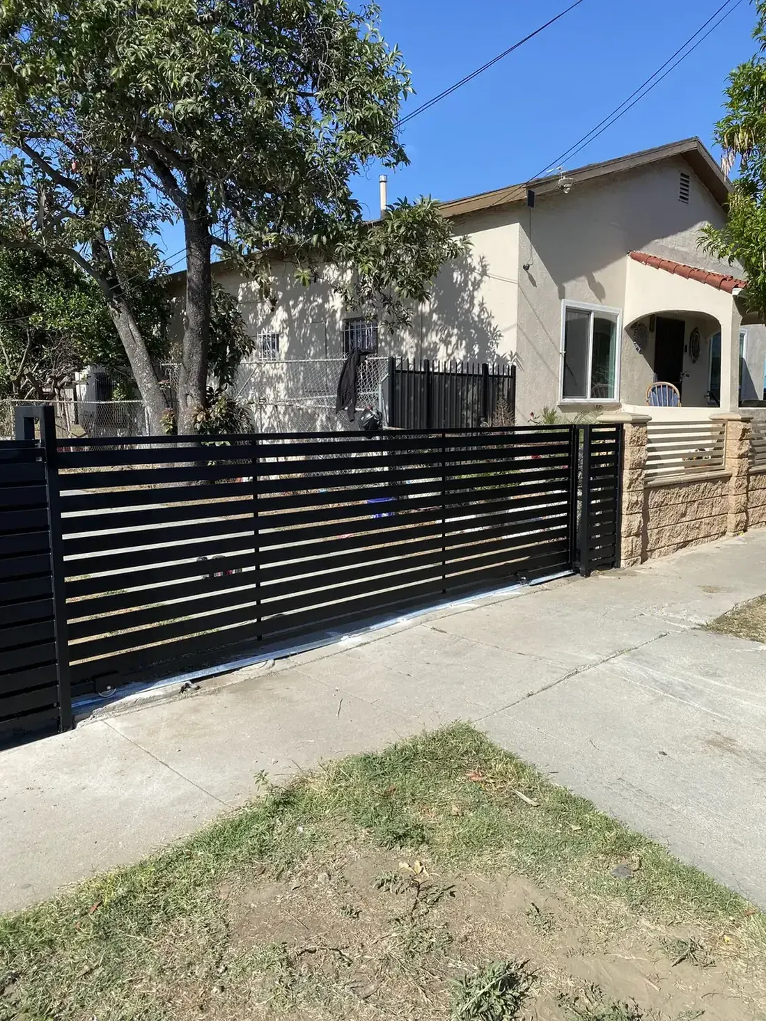 Custom black slat front-yard gate